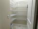 Walk-in pantry with lots of white wire shelving at 564 Meandering Way, Polk City, FL 33868