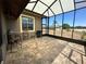 Relax in this large, screened patio featuring brick flooring, ideal for outdoor entertaining at 564 Meandering Way, Polk City, FL 33868