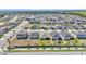 Expansive aerial view of a well-planned community featuring neatly arranged homes and green spaces at 613 Sarner Pass Way, Winter Haven, FL 33881
