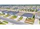 An elevated shot showcasing the homes in a community near a large lake at 613 Sarner Pass Way, Winter Haven, FL 33881
