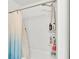 Modern bathroom featuring a shower and bathtub with blue and white shower curtain at 613 Sarner Pass Way, Winter Haven, FL 33881
