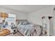 Cozy bedroom with natural light, a comfortable queen-sized bed, and carpet flooring at 613 Sarner Pass Way, Winter Haven, FL 33881