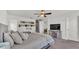 Bedroom with a cozy bed, TV, and stylish decor, creating a welcoming and comfortable retreat at 613 Sarner Pass Way, Winter Haven, FL 33881