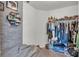 Walk-in closet with shelves, hanging racks, and organized storage space, ideal for wardrobe management at 613 Sarner Pass Way, Winter Haven, FL 33881