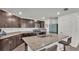 Well-equipped kitchen with granite counters, stainless steel appliances, and ample cabinet space at 613 Sarner Pass Way, Winter Haven, FL 33881