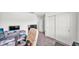 Office space with hardwood floors, a sliding door closet, and a desk area for work or study at 613 Sarner Pass Way, Winter Haven, FL 33881
