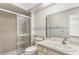 Bathroom with a step-in shower and single sink vanity at 697 Broadmoor Cir, Winter Haven, FL 33884