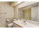 Bathroom with a floral wallpaper, a single sink, a big mirror, and a skylight at 697 Broadmoor Cir, Winter Haven, FL 33884