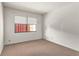 Simple bedroom with neutral carpet, a window, and accessible electrical outlets at 697 Broadmoor Cir, Winter Haven, FL 33884
