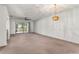 Spacious living room has access to Florida room and features wet bar for entertaining at 697 Broadmoor Cir, Winter Haven, FL 33884