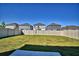 Spacious, newly sodded backyard with wood fencing and young trees at 752 Reggie Rd, Winter Haven, FL 33884