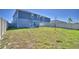 Fenced-in backyard showing ample green space, and views of adjacent homes at 752 Reggie Rd, Winter Haven, FL 33884