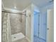 Modern bathroom with a tiled shower, sleek fixtures, and a minimalist design at 752 Reggie Rd, Winter Haven, FL 33884