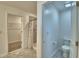 Clean and modern bathroom featuring a tiled shower, toilet, and access to walk-in closet at 752 Reggie Rd, Winter Haven, FL 33884