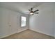 Bedroom featuring neutral carpet, ceiling fan, and a window with view at 752 Reggie Rd, Winter Haven, FL 33884