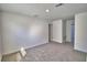 This bedroom features neutral carpet and multiple doors to other rooms at 752 Reggie Rd, Winter Haven, FL 33884