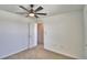 Bedroom with neutral carpet, ceiling fan, and a white door at 752 Reggie Rd, Winter Haven, FL 33884
