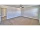 Spacious bedroom with neutral carpet, ceiling fan, and connecting room at 752 Reggie Rd, Winter Haven, FL 33884