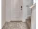 Close up shot of the front door and stairwell. Tile flooring and white trim at 752 Reggie Rd, Winter Haven, FL 33884