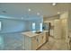 Open-concept kitchen with a large island, stainless steel appliances, and ample counter space for cooking and entertaining at 752 Reggie Rd, Winter Haven, FL 33884