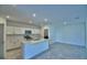 Modern kitchen with stainless steel appliances, a center island, and plenty of cabinet space for storage at 752 Reggie Rd, Winter Haven, FL 33884