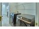 Convenient laundry area featuring modern washer and dryer units, with easy access to kitchen at 752 Reggie Rd, Winter Haven, FL 33884
