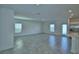 Spacious living room filled with natural light, offering a comfortable and inviting atmosphere with kitchen access at 752 Reggie Rd, Winter Haven, FL 33884