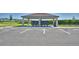Community mailboxes sit beneath a covered structure with adjacent parking at 752 Reggie Rd, Winter Haven, FL 33884