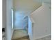 Carpeted staircase leads up to the second story with natural light from window at 752 Reggie Rd, Winter Haven, FL 33884