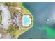 Overhead photo showcases community pool, lake, and surrounding landscaping at 7779 Lake James Blvd, Lakeland, FL 33810