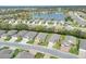 Aerial view of a well-planned residential area with beautiful landscaping and a nearby lake at 7779 Lake James Blvd, Lakeland, FL 33810