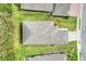 Aerial view of home showing roof, landscaping and patio at 7779 Lake James Blvd, Lakeland, FL 33810