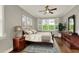 Comfortable bedroom with natural light, ceiling fan, and well-placed furniture at 7779 Lake James Blvd, Lakeland, FL 33810