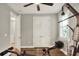 The exercise room features hardwood floors, a ceiling fan, and a variety of exercise equipment at 7779 Lake James Blvd, Lakeland, FL 33810