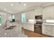 Updated kitchen with stainless appliances, stone countertops, and modern lighting at 7779 Lake James Blvd, Lakeland, FL 33810