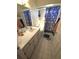 Bathroom featuring a vanity with ample storage, a mirror, and shower at 7818 Lewis Rd, Lakeland, FL 33810