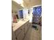 Bathroom featuring a vanity with ample storage, a mirror, and shower at 7818 Lewis Rd, Lakeland, FL 33810