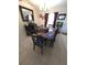 Inviting dining space with decorative mirror, furniture, and natural light at 7818 Lewis Rd, Lakeland, FL 33810