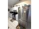 Well-lit kitchen with stainless steel appliances and ample cabinet space at 7818 Lewis Rd, Lakeland, FL 33810
