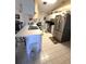 Well-lit kitchen with stainless steel appliances and ample cabinet space at 7818 Lewis Rd, Lakeland, FL 33810