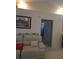 Bright living room featuring tile flooring, recessed lighting, and a comfortable leather sofa at 7818 Lewis Rd, Lakeland, FL 33810