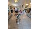 Spacious living room featuring an open floor plan and view of dining area and kitchen at 7818 Lewis Rd, Lakeland, FL 33810