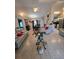 Open floor plan showing living room with tile floors and natural light at 7818 Lewis Rd, Lakeland, FL 33810