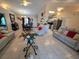 Open floor plan showing living room with tile floors and natural light at 7818 Lewis Rd, Lakeland, FL 33810