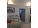 Bright living room featuring tile flooring, recessed lighting, and a comfortable leather sofa at 7818 Lewis Rd, Lakeland, FL 33810