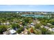 Picturesque aerial view of homes nestled around Lake Morton under a clear blue sky at 805 Johnson Ave, Lakeland, FL 33801