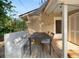 Comfortable back porch with built-in seating, wooden floors, and shade covering at 805 Johnson Ave, Lakeland, FL 33801