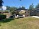 Inviting backyard with patio seating and an umbrella for shade, great for outdoor gatherings at 805 Johnson Ave, Lakeland, FL 33801