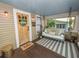 Relaxing front porch with comfortable seating, wood accents, and an inviting 