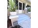 Inviting front porch steps, framed by potted plants, lead to the entryway of a classic century home at 805 Johnson Ave, Lakeland, FL 33801